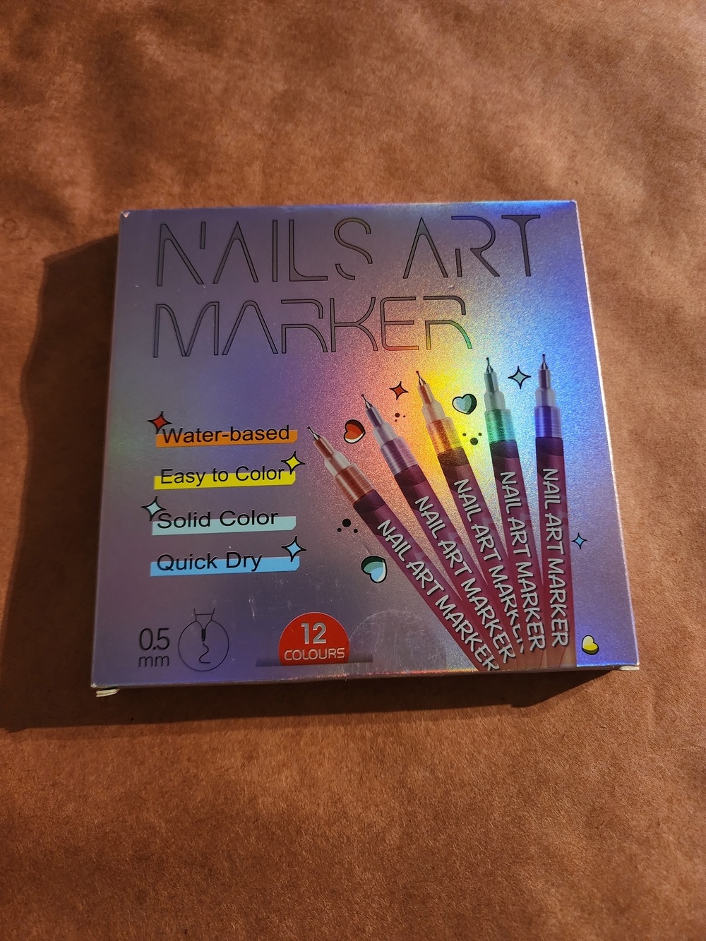 12 vibrant nail art markers featuring a 0.5 mm tip for detailed designs,